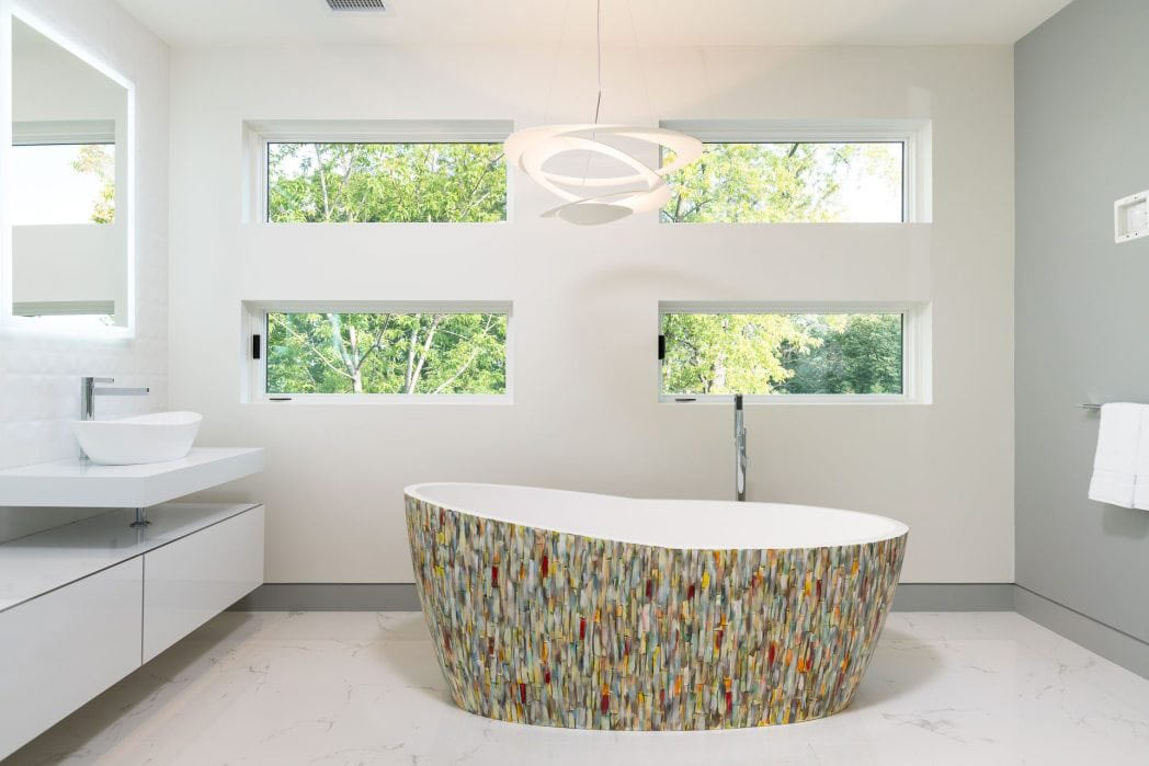 Bright modern bathroom with freestanding mosaic-tiled soaking tub